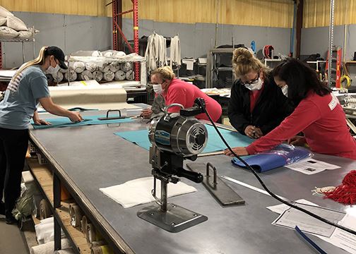 people making masks